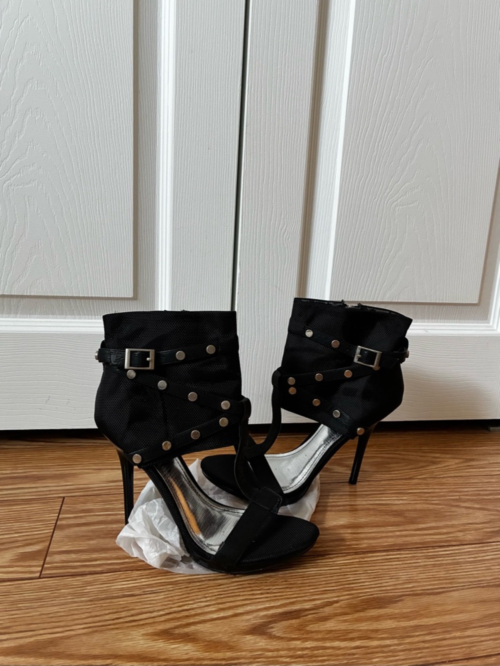 Edgy heeled sandals with studded ankle cuffs